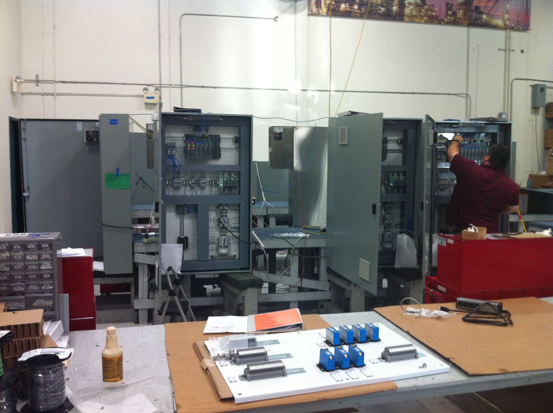 UPSS control panels staged for fabrication and testing in a panel shop